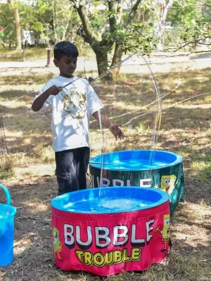 A "Bubble Trouble" game station provides hours of fun for kids at an outdoor party. We can arrange a variety of games and activities suitable for all ages.