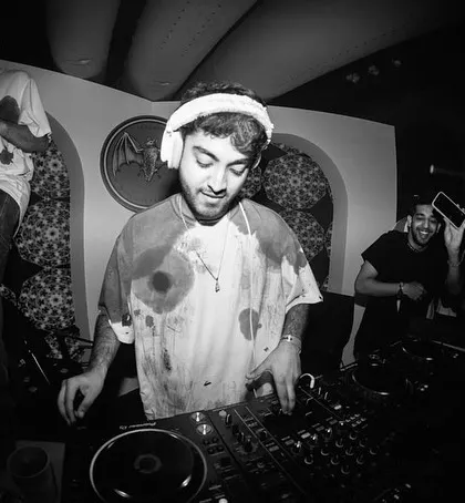 A black and white shot of me enjoying the moment at the Casa Bacardi party. The vibe was just right, and the crowd was with me on every track.