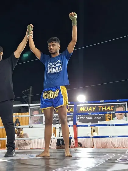 Another victory for the team. Our fighter stands victorious, showcasing the effectiveness of our Muay Thai training program.