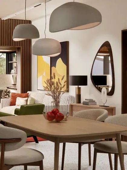 The open-plan living and dining area of the HAUS 5 duplex, where terrazzo flooring, wood-paneled walls, and a curated selection of furniture create a cohesive and inviting atmosphere.