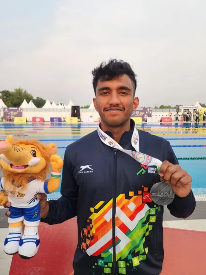 S Dhakshan with his silver from the 200m Freestyle.