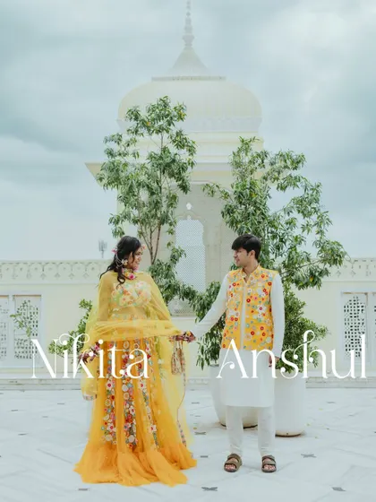 A beautiful couple portrait at their Haldi ceremony in Jaipur, with the stunning architecture of the Hyatt Regency in the background.