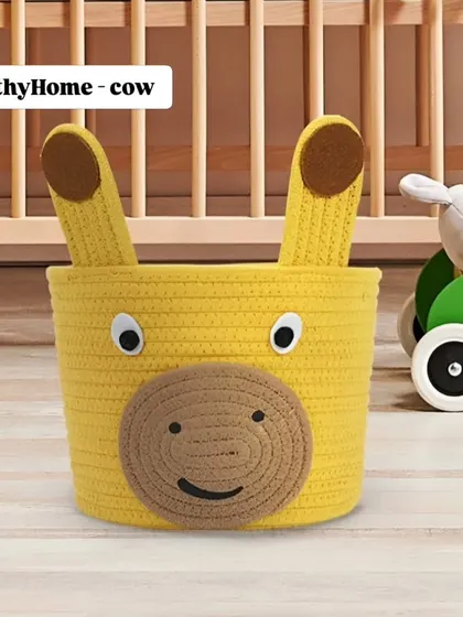 This yellow cow rope basket with sturdy handles is easy for little hands to carry. Use it to teach kids how to organize their own toys and books.