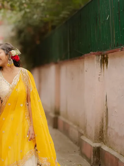 A candid shot from our Haldi ceremony, filled with laughter. Capturing these fleeting, happy moments is a core part of my wedding photography philosophy.