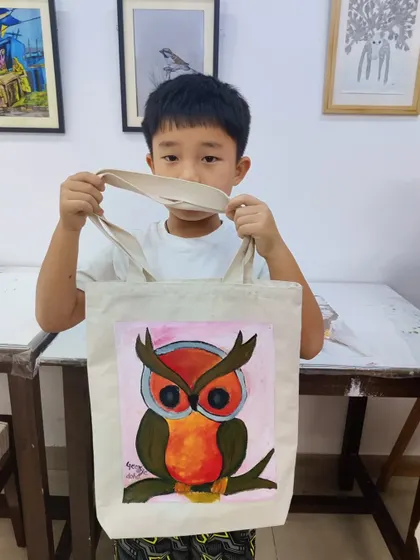 A large collection of our students with their finished paintings, showcasing a wide variety of subjects and styles.