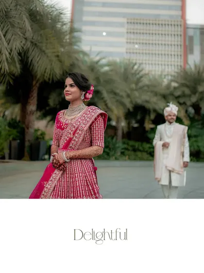 A beautiful shot of the couple walking down the steps of the Sheraton Grand. The bride's flowing lehenga and their happy expressions make for a perfect portrait.