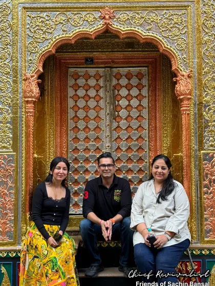 Our founder, Sachin Bansal, with friends in front of a stunning golden door in Naughara. We believe in celebrating the stories hidden within India's monuments with every step.