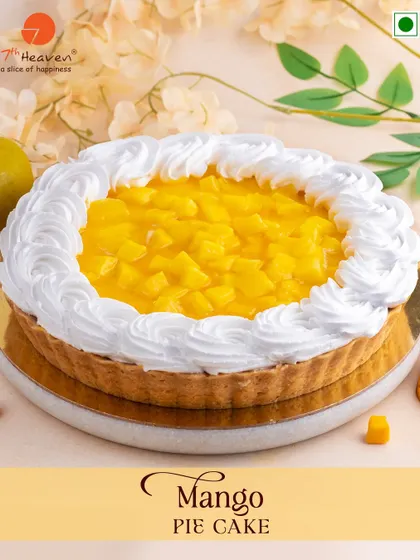 When life gives you mangoes, we make a Mango Pie Cake. This dessert features a buttery pie crust filled with fresh, juicy mango and topped with fluffy whipped cream.