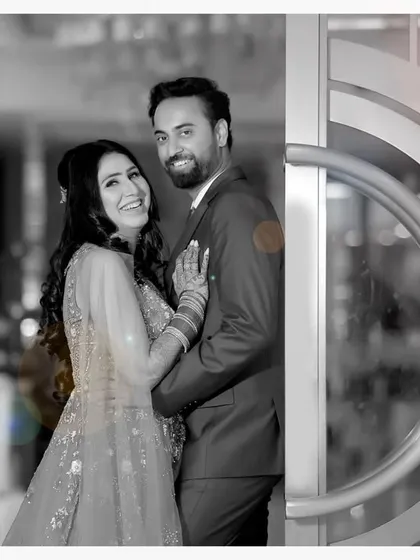 A creative edit of a couple's portrait, using a black and white background with a pop of color on the couple to make them stand out. This shows my ability to add an artistic touch.