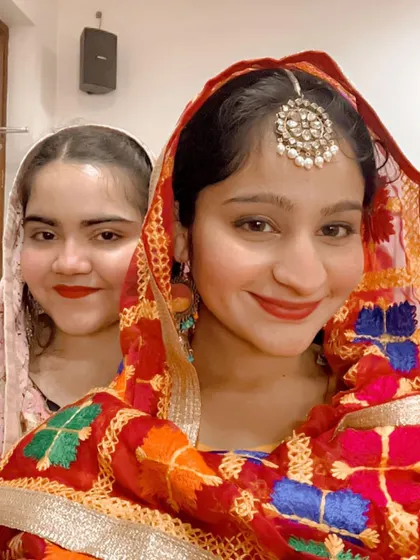 A selfie in my vibrant Punjabi folk costume before a performance. I love the energy and color of folk music and traditions.