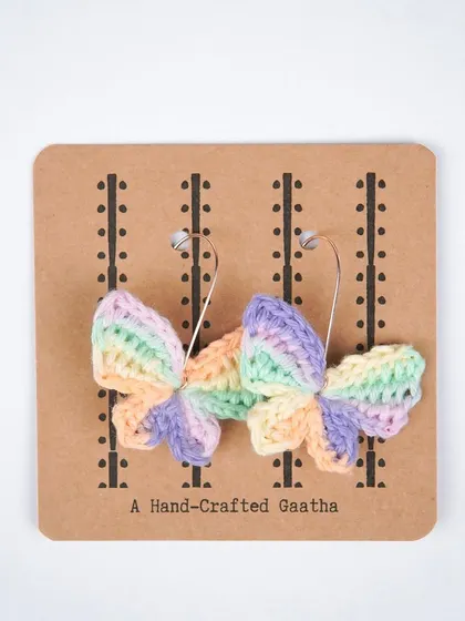 A clean product shot of the bestselling multi-color butterfly earrings. The colors are soft, dreamy, and go with so many outfits.