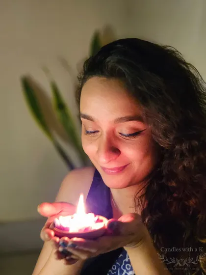 A moment of peace and gratitude during Diwali. Holding one of my own handmade candles reminds me why I love what I do.