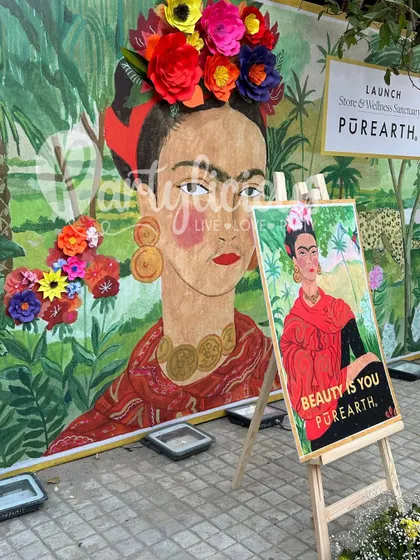 A vibrant Frida Kahlo inspired backdrop created for a store launch, showcasing our ability to create artistic and branded event decor.