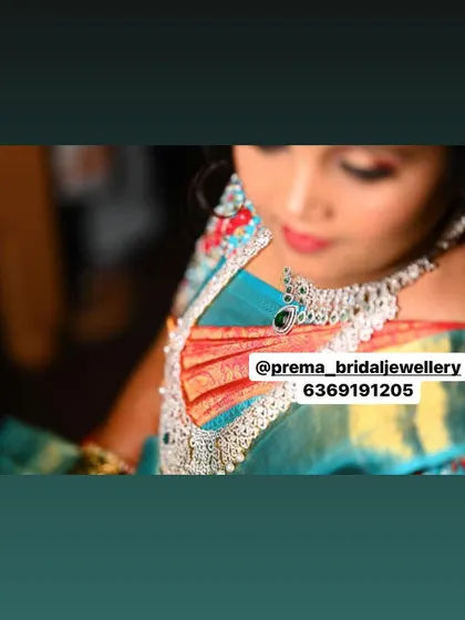 A high-angle shot of the AD and emerald necklace.