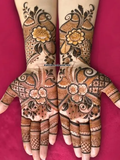 A full-hand floral design, perfect for an engagement or sangeet. The use of negative space and different floral motifs creates a modern and artistic look.