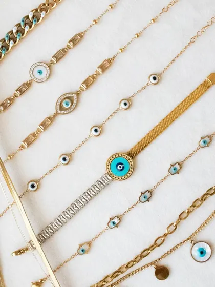 Another view of my evil eye bracelet collection. I love how the different styles and textures look together.