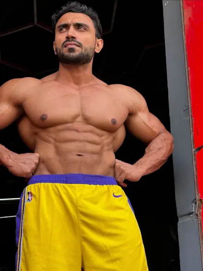 Another angle, showing the chest and ab development.