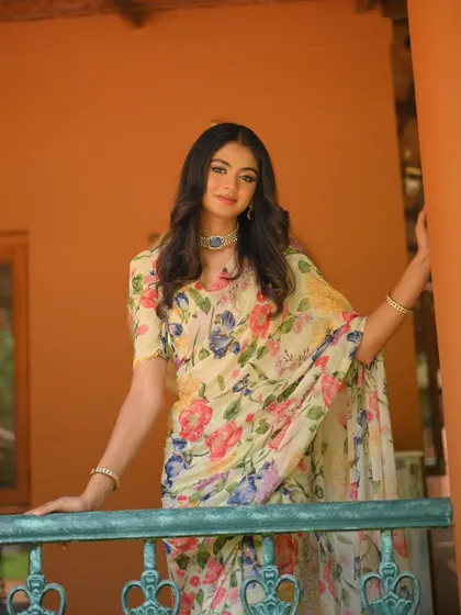 Another view of the white floral chiffon saree, perfect for a sophisticated daytime look.