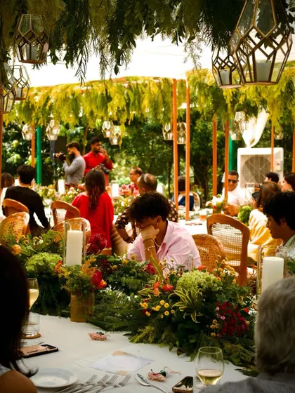 Guests enjoying the beautiful outdoor setting at the Bangalore Nostalgia dinner in Nandi Hills.