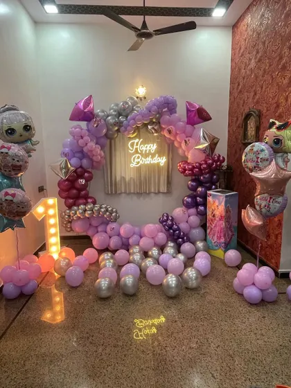 This is a duplicate of ID 5. A princess-themed birthday party with a modern twist. This setup features a circular balloon arch in shades of pink and purple, a neon 'Happy Birthday' sign, and a light-up marquee number '1'.