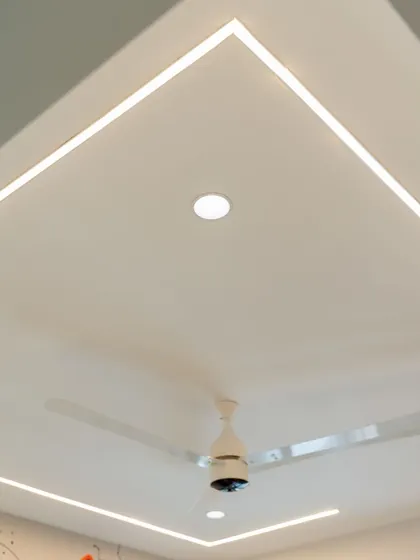 The ceiling in the kids' room features modern profile lighting, providing bright, even illumination for both play and study.