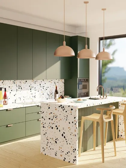 This client wanted a kitchen that would make them excited to cook at home. I designed this vibrant space with deep green cabinets, a playful terrazzo countertop and backsplash, and warm pendant lighting.