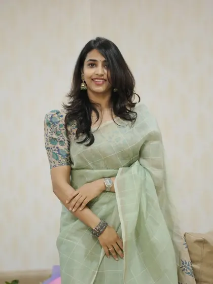 A beautiful portrait of Sapthami Gowda, showcasing her custom-paired blouse and saree.