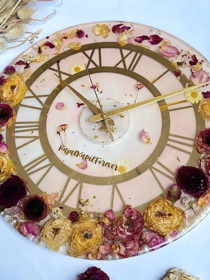 Another beautiful 16-inch clock. The soft pink resin and a mix of yellow and red preserved roses create a warm and romantic timepiece.