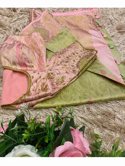 The complete look: a custom pink and green embroidered blouse paired with a matching Kanjeevaram saree.