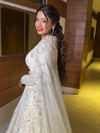A beautiful profile shot of Vaishali, showing off her dramatic ponytail and the elegant lines of her makeup. This look is all about confidence.