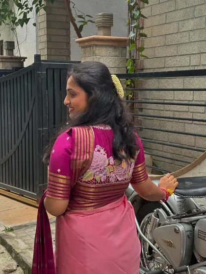 Another angle showing the perfect fit and design of the embroidered blouse, which complements the saree beautifully.