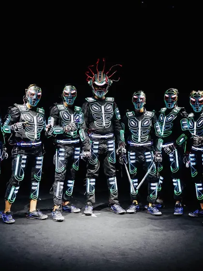 A powerful group pose showcasing the full crew in our armored Tron costumes. Each suit has a unique helmet design, adding to the futuristic warrior look of the performance.