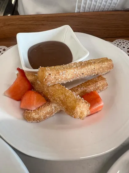 Our first sit-down lunch service, featuring freshly made churros with chocolate dipping sauce and strawberries.