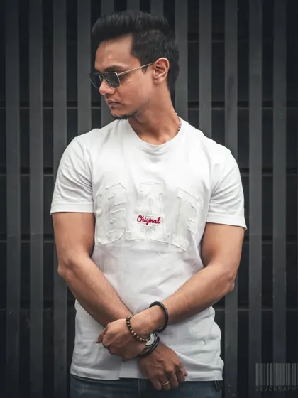 A street style portrait against a striped background. The vertical lines create a strong composition, making the subject pop. This is perfect for fashion bloggers or anyone wanting a modern, urban look.