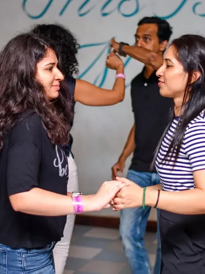 Friends enjoying a dance together. La Rumba is a place where you can catch up with your buddies through the joy of dance.