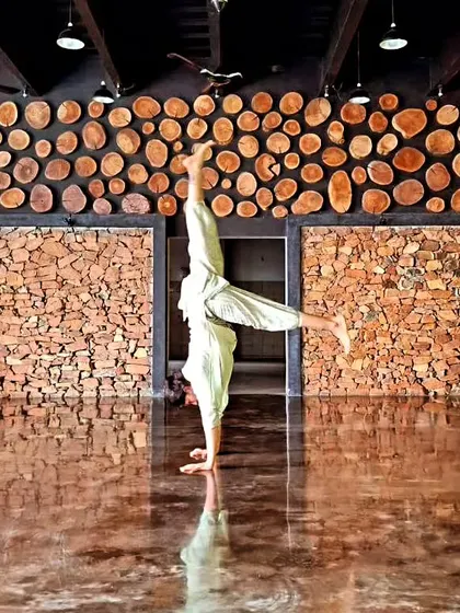 Even as a teacher, I am always a student. Returning to Mysore to learn from my teacher is essential for my growth. This handstand, in a space dedicated to practice, reminds me to stay curious and humble.