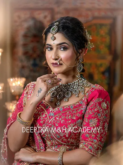 A portrait of the bride looking confidently at the camera. Her hand tattoo is visible, adding a modern touch to the traditional look.
