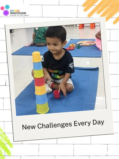 A toddler masters the stacking cups, a simple yet powerful activity for developing hand-eye coordination, understanding size and sequence, and experiencing the satisfaction of completing a challenge.