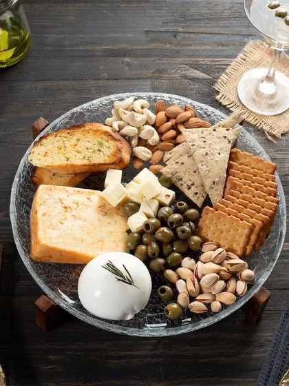This cheese platter shot is a great example of my styling work. I carefully arranged each element, from the cheese and crackers to the olives and nuts, to create a composition that is balanced, abundant, and visually appealing.