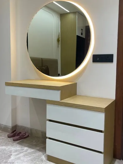 Hello, beautiful. A minimalist floating dressing table with a simple round backlit mirror. The two-tone wood and white finish gives it a clean, Scandinavian-inspired look.