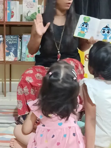 A close up showing the colorful illustrations of the book being shared with the young audience.
