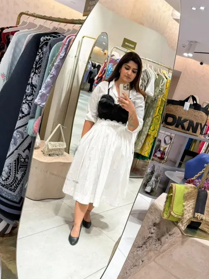 A mirror selfie capturing the complete look, perfect for a chic day out or a semi-formal event.