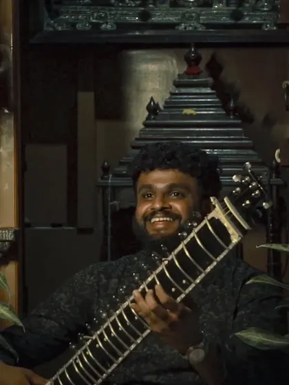 A happy, relaxed moment with my sitar. This photo captures the peaceful and content feeling that music brings to my life.
