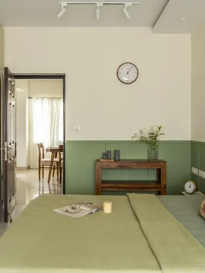 A classic English-style guest bedroom with a soothing green and beige color scheme. I used wicker inserts in the wardrobe doors to add a touch of natural texture to the minimalist interior.