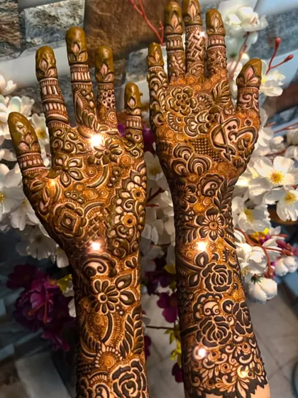 A beautiful example of a finished bridal mehendi, with sparkles showing the fresh paste. The details are everything.