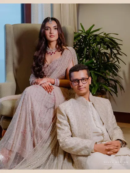 A formal portrait with a modern, editorial feel. The posing and composition create a look of sophisticated elegance.