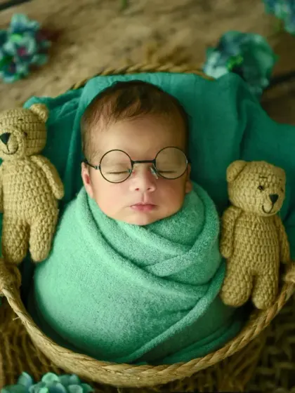A touch of whimsy for this little scholar. I love adding small, creative props like these tiny glasses to bring out a unique personality in each newborn session.