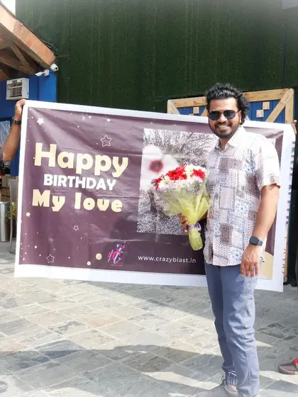 Even if you're far away, we can deliver a surprise on your behalf. Here, we're presenting a birthday banner and bouquet from a loved one who couldn't be there.