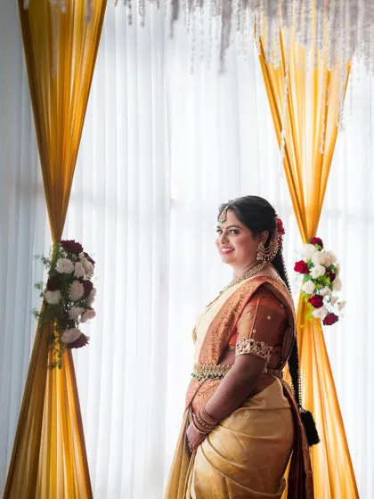 A beautiful portrait of the bride, framed by the elegant decor of her wedding venue.