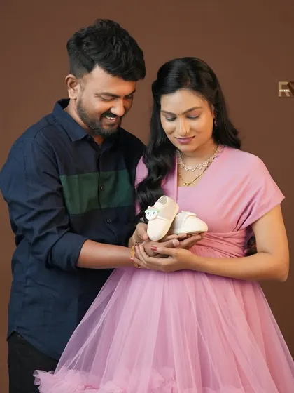 The little shoes say it all. This sweet close-up shot of the couple holding a tiny pair of baby shoes is a perfect way to announce your pregnancy or simply capture the anticipation.
